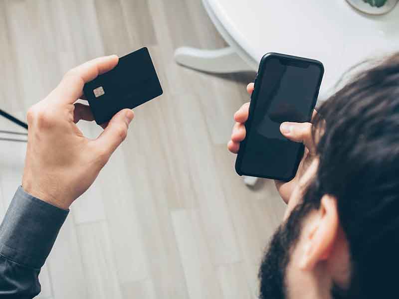 Client completing a purchase using a Pay by Link solution on their device